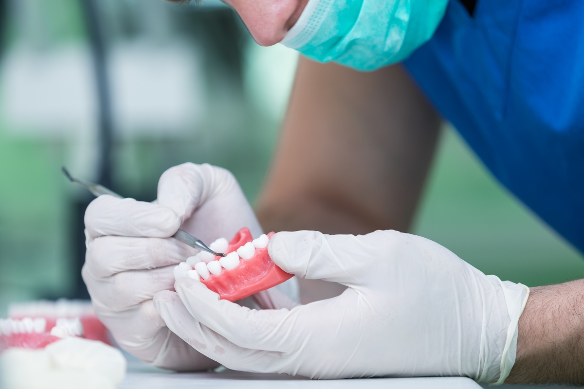 dentist fixing dentures